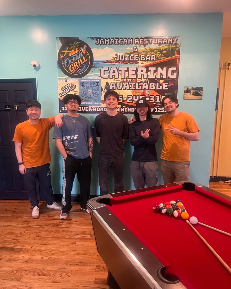 Friends gathered inside Ocean Grill by the pool table